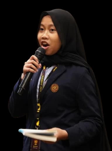 JOINMUN delegate speaking into a microphone